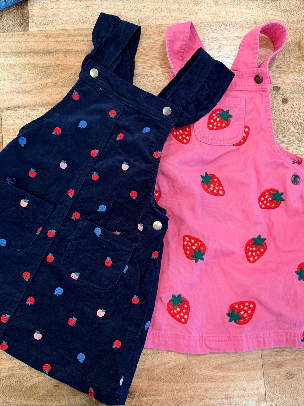 cupcakes & cashmere Kids Apple and Strawberry Pinafores  - Pink & Navy